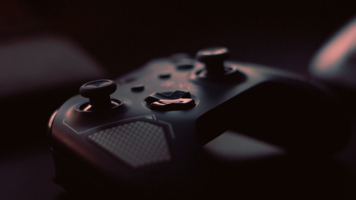 A close-up shot of a game controller in low light, highlighting its design and buttons. — Experience Hassle-Free Access Using